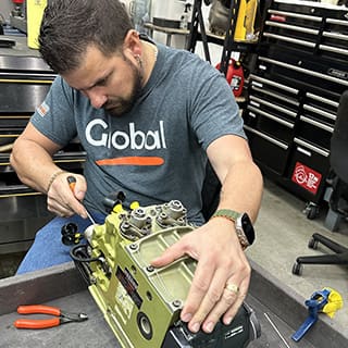 Global AirServices, LLC technicians working on aircraft components