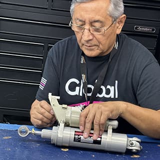 Global AirServices, LLC technicians working on aircraft components