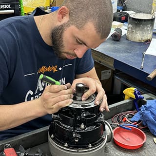 Global AirServices, LLC technicians working on aircraft components