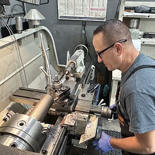 Global AirServices, LLC technicians working on aircraft components