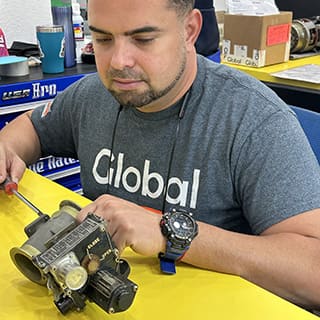 Global AirServices, LLC technicians working on aircraft components