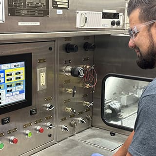 Global AirServices, LLC technicians working on aircraft components